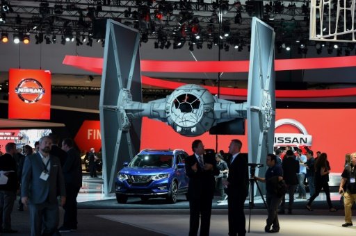 A 2017 Nissan Rouge is displayed under a Star Wars TIE fighter ahead of the public opening of the Los Angeles Auto Show. - AFP Photo