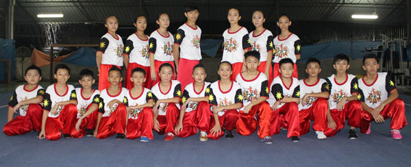 The Sarawak wushu team in a group photograph before a training session at the Sarawak Wushu Elite Training Centre at Kota Sentosa Sports Centre, Stakan recently.