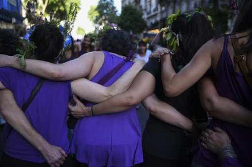 Activists march during the commemoration of the International Day for the Elimination of Violence Against Women in Buenos Aires on November 25, 2016, with other marches planned in Chile, Uruguay, Colombia, Venezuela, Guatemala and Peru. - AFP Photo