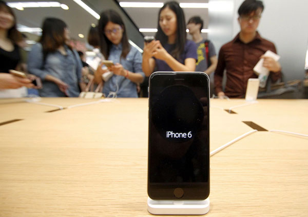 File photo shows customers visiting a new Apple store in Nanjing, eastern China’s Jiangsu province. — AFP photo