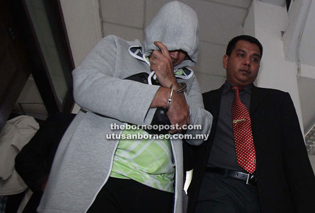 Ag Tahir being taken out of the courtroom yesterday. 