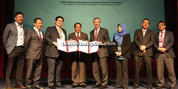 (From left) Naguib, Dzulkifli, Tan, Ahmad Maslan, Collingridge, Noraini, Nik Norzul and Rahmandin during the MOU signing yesterday. 