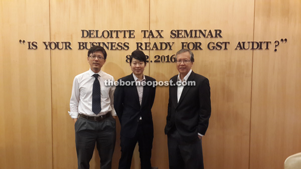 (From right) Koh, Bong and Deloitte partner Wong King Yu had a photo session after the tax seminar yesterday.