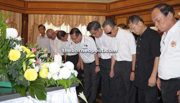 (From second left) Yii, Ting and Lee pay their last respects.