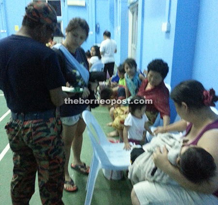 Ten children are among the 19 flood victims putting up at Trusan Community Hall on Tuesday.