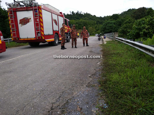 Fire and Rescue personnel are stationed at the bridge where the victim and his friends are said to have jumped into the river.