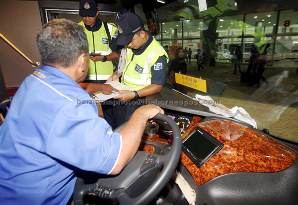 SPAD personnel conducting checks during an operation at Kelantan Sentral Terminal in Kuantan. — Bernama photo
