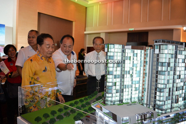 (From front left) Wong listens to a briefing on the project by Lee, as Tiong looks on. Far at the back is Justine.