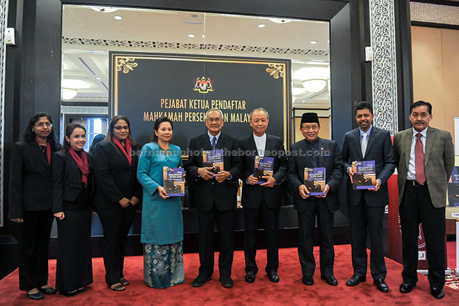 Tun Arifin (fourth right) with Rais Yatim (third right) after launching the ‘The Malaysian Judiciary’ book at the Palace of Justice. — Bernama photo