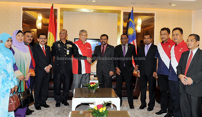 Ahmad Zahid (sixth, left) shaking hands with Progressive Party of Maldives vice-president Abdul Raheem Abdulla during a courtesy call on the deputy prime minister at Putra World Trade Centre yesterday. — Bernama photo