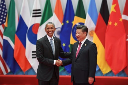 China's President Xi Jinping (R) shakes hands with US President Barack Obama before the G20 leaders' family photo in Hangzhou on Sept 4, 2016. AFP Photo