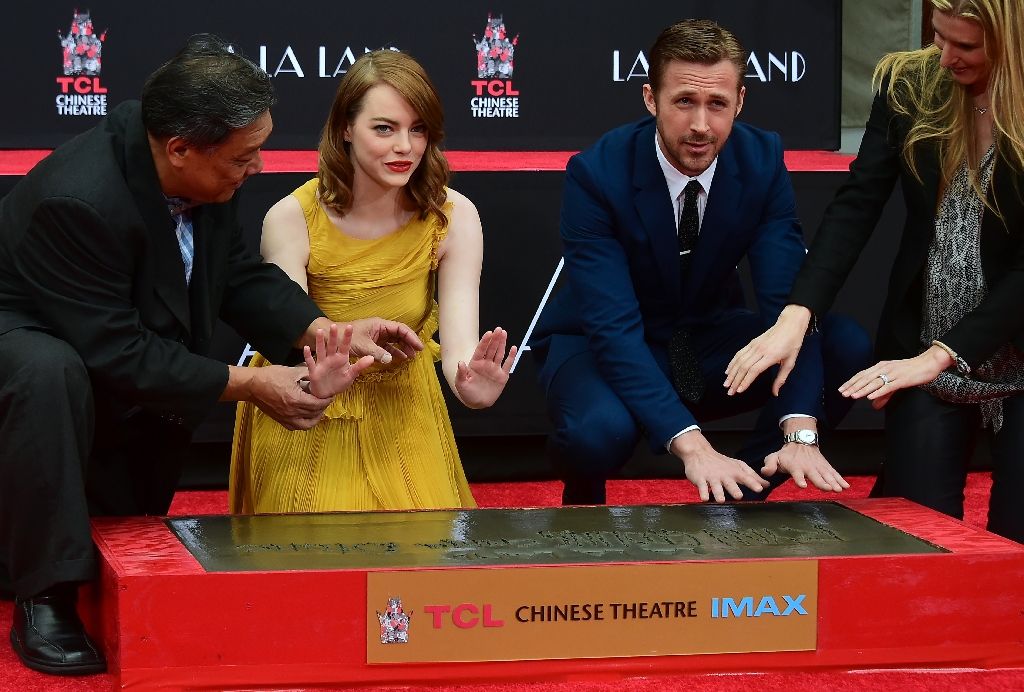 Actors Emma Stone and Ryan Gosling at their Hand and Foot prints ceremony in front of the TCL Chinese Theater in Hollywood on December 7, 2016 ahead of the release of the film LA LA Land. AFP Photo