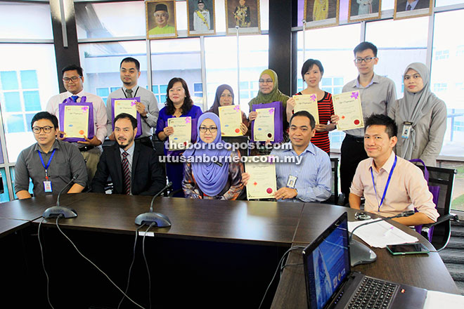 Dr Jamilah (seated centre) with recipients of GMP and MeSTI certificates. Deputy health director Mohammad Jefri Crossley is seated second left. — Photo by Jeffery Mostapa