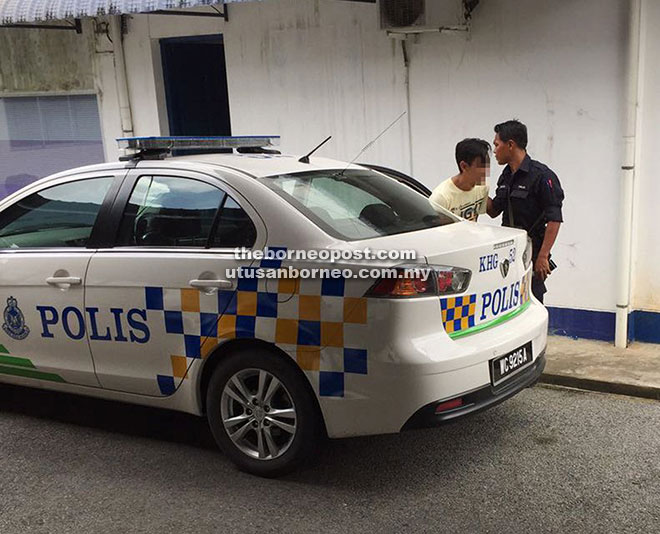 The motorist is brought to the district police headquarters for questioning following his failed escape bid.