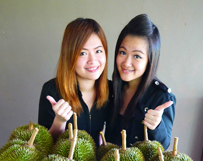 Models giving the thumbs-up to durians from Mew Yeh Nursery.