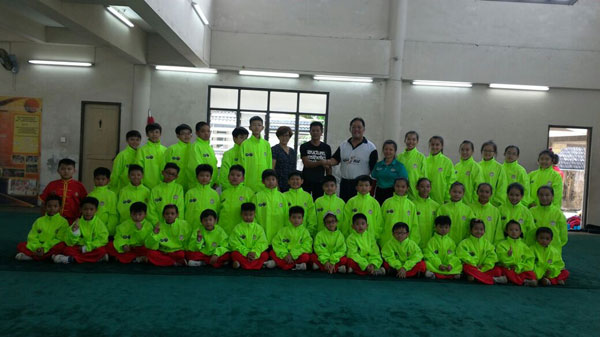 WFS vice president James Ting (eighth right) wishing Kuching team manager Bong Chong Jan (eighth left) and his team the best of luck while coach Ling Ung Hee (seventh right), official Voon Shuu Ping (seventh left) and others look on at WFS premises at Tabuan Laru recently.