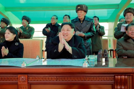 An analyst says North Korea leader Kim Jong-Un (C) "knows exactly what he is doing" and will not provoke Seoul or Washington. AFP File Photo