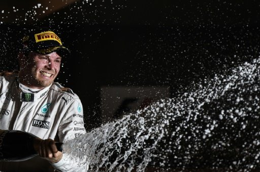 "I'm so proud to be here. It's been a pretty intense period but it was my childhood dream," said Mercedes driver Nico Rosberg after receiving the world championship F1 trophy. AFP Photo