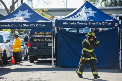 Officials say they expect to recover more human remains from a warehouse in Oakland that went up in flames late Friday, trapping dozens of partygoers attending a rave. AFP Photo