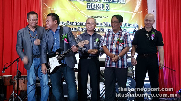 Miro (fourth right) strums a guitar to officially launch the concert, witnessed by (from right) Mike, Sudin, Hipni and Edward.