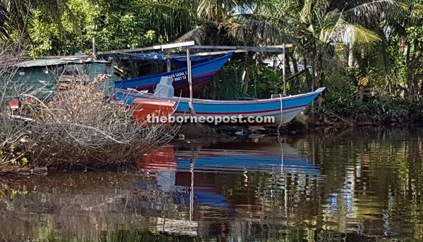 Photo shows two Suluk fishing boats berthed along the Miri River, which were detected by the Fisheries Department recently.