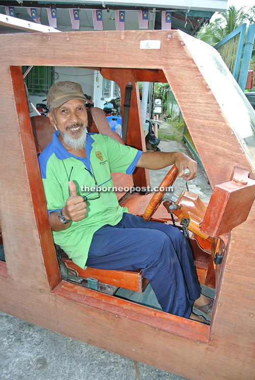 Sulaiman shows thumbs-up for his plywood-based creation.