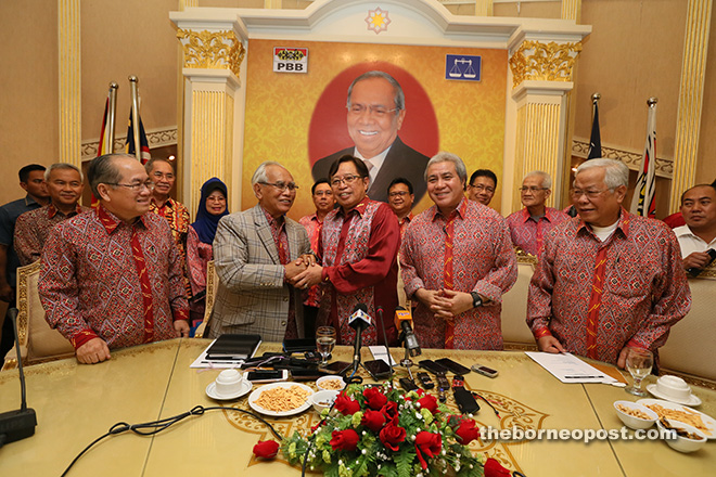 Abang Johari (front centre) shakes hands with Jabu at the press conference. From front left are Uggah, Awang Tengah and PBB vice-president Dato Sri Michael Manyin Jawong.