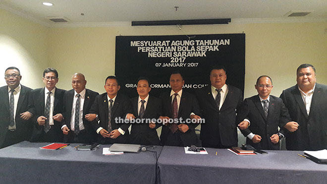 New football president Posa (centre) with the FAS exco members after the EGM at a local hotel yesterday. 