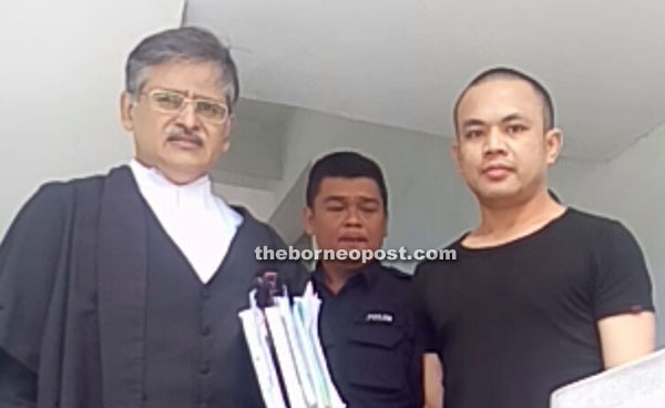 Mohammad Noor (right) leaving the courtroom with his counsel Rakhbir (left).
