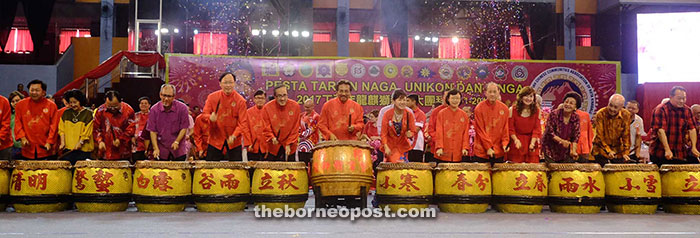 Musa (middle), Wong (seventh from right), ministers and other invited guests  beating the drums to mark the launch of the Dragon, Unicorn and Lion Dance Festival.