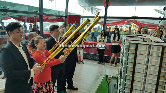 Koisun (second left), accompanied by Chong (left) and Wong (third left), marked the official opening of SkyVue Residence with a confetti launch yesterday.