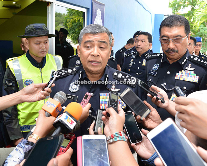 Khalid being interviewed by the media during his working visit to the General Operations Force (GOF) headquarters in Kinarut yesterday, as Ramli (right) looks on. 