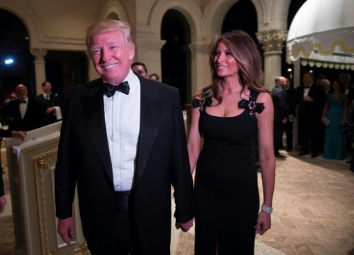 US President-elect Donald Trump arrives with his wife Melania for a New Year's Eve party at Mar-a-Lago in Palm Beach, Florida, on Dec 31, 2016. AFP Photo