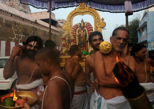  Indian temple priests carry an idol of Hindu god Parthasarathy in Chennai, capital of Tamil Nadu state, which is home to centuries-old religious artefacts. - AFP Photo
