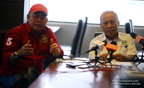 Saidi (left) explaining a point during the press conference. Also seen is Abang Nawawi. — Photo by Muhammad Rais Sanusi