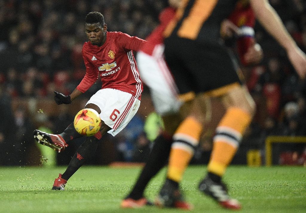 Manchester United's midfielder Paul Pogba strikes the ball as he takes a free-kick during the EFL Cup semi-final football match against Hull City Jan 10, 2017. AFP Photo