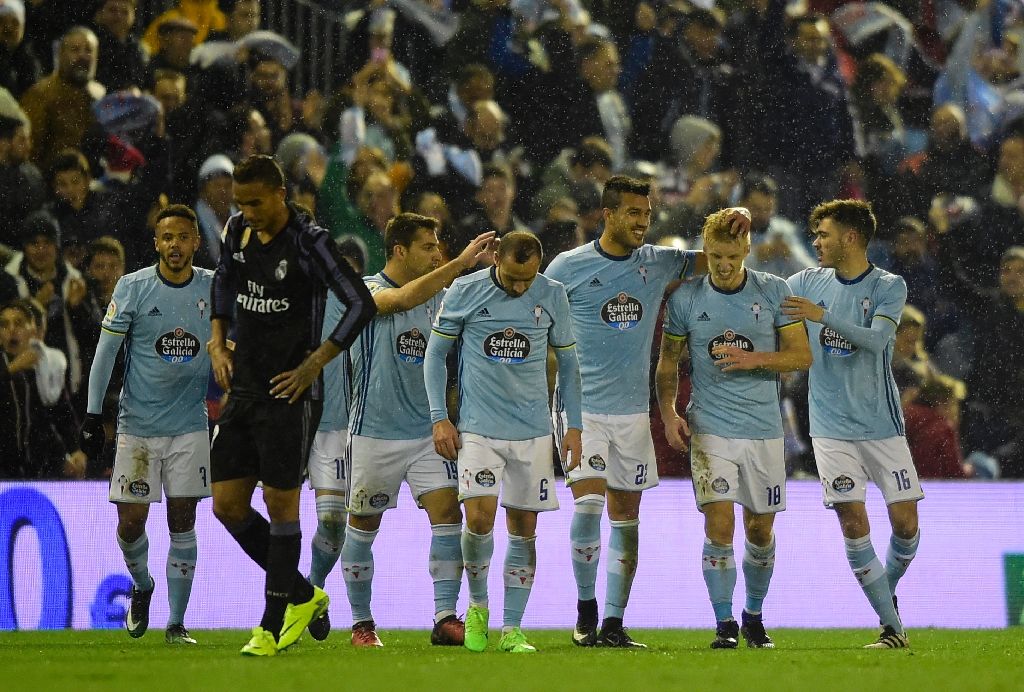 Celta Vigo's midfielder Daniel Wass (2ndR) is congratulated by teammates after scoring during the Spanish Copa del Rey quarter final second leg football match against Real Madrid Jan 25, 2017. AFP Photo