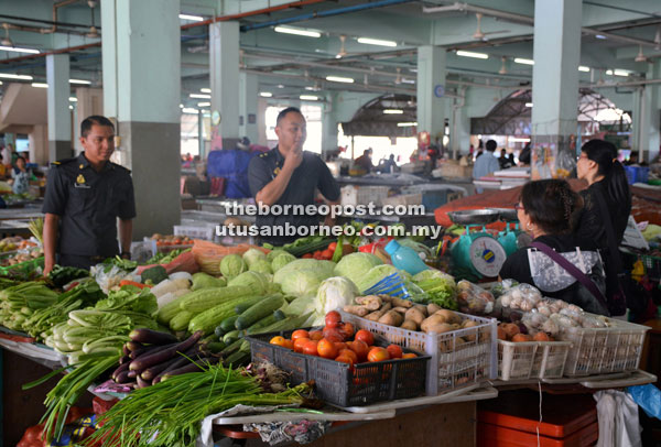 KPDNKK Sibu personnel conduct price checks at Sibu Central Market as shown in this file photo.