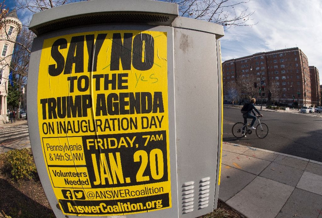 Street posters calling for protests are seen in the Dupont Circle area of Washington, DC, a week before the Inauguration of Donald Trump as US president. AFP Photo