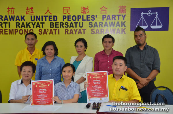 Kho (seated centre) and members of the event working committee at the press conference. — Photo by Wilfred Pilo