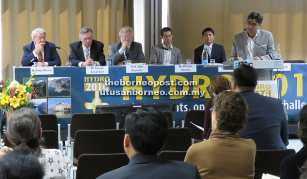 Mubasher (right) delivering a presentation at the Hydro 2016 International Conference and Exhibition  in Montreux, Switzerland last October. 