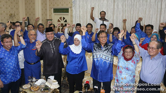 Jamilah (centre) with Abang Johari (third right) and others joining hands to mark BN’s Tanjong Datu by-election victory. - Photo by Jeffery Mostapa
