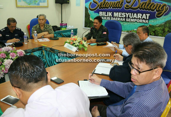 Wan Abdul (third left) chairing the Tourist Jetty and Other Security Aspects of Maritime Tourism Boats Coordination meeting yesterday in Semporna.