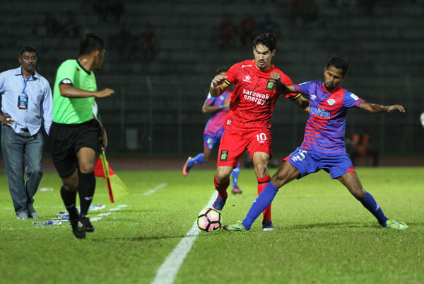 Hartmann up against a MISC-MIFA player on Tuesday. — Photo by Chimon Upon 