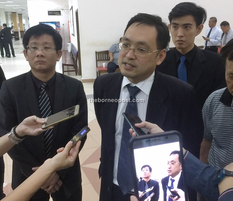 Tan (left) and Chong speaking to reporters after the court proceedings.