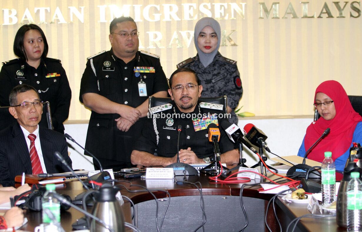 Mustafar (seated, centre) speaking at the press conference.