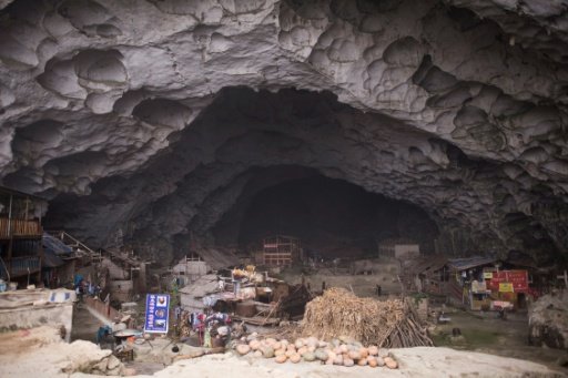 Zhongdong village, where a group of 18 families live inside an enormous natural cave with all the modern conveniences, like electricity - AFP/Becky Davis