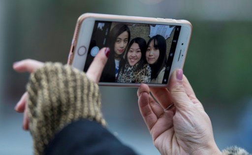 China has a world-leading 700 million mobile-Internet users, vast numbers of whom use apps to fuss over their digital appearance. - AFP Photo