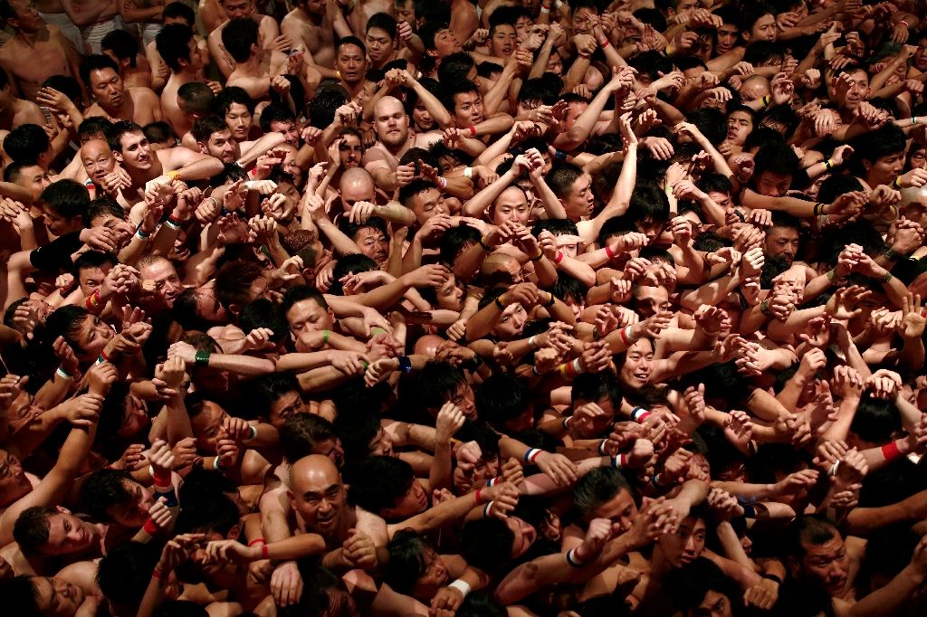 Around 10,000 hardy souls formed a writhing mass of sweaty worshippers inside Saidaiji Temple in Okayama, western Japan for the Naked Man Festival. AFP Photo