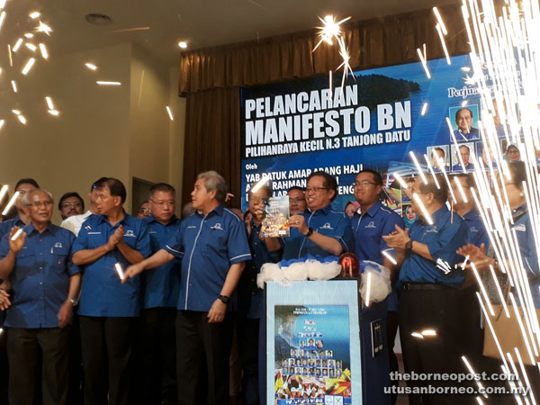 (From left) Former deputy chief minister Datuk Patinggi Tan Sri Alfred Jabu, SUPP secretary general Datuk Sebastian Ting, SPDP president Datuk Seri Tiong King Sing, PBB acting deputy president Datuk Amar Awang Tengah Ali Hasan, Abang Johari, Adenan’s youngest son Azizul Annuar Adenan and Deputy Chief Minister Datuk Amar Douglas Uggah Embas at the launch of BN manifesto for Tanjong Datu by-election.